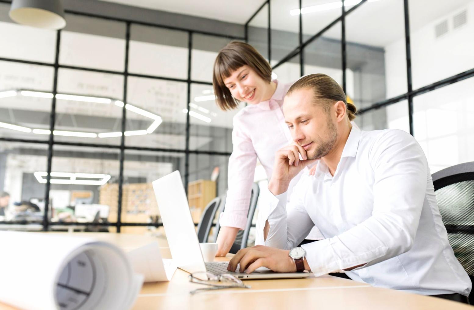 Team collaboration on payment processing interface with mobile and desktop screens